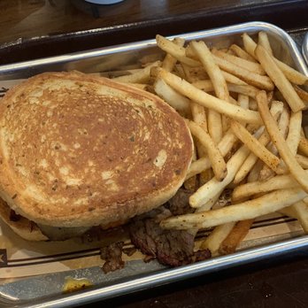 Regal Eagle Smokehouse: Craft Drafts & Barbecue - Brisket sandwich with fries - Barbeque Near Me - Lake Buena Vista, Florida Regal Eagle Smokehouse: Craft Drafts & Barbecue - Brisket sandwich with fries - Barbeque Near Me - Lake Buena Vista, Florida