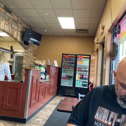 The Hangry Hornet - They have chips,drinks, tv, a bathroom and three dining tables.