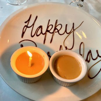 Orange Hill Restaurant - Very sweet -- they overheard us say that it was my birthday so when they brought out our creme brûlée dessert they did this. :) - New American Near Me - Newburgh, New York