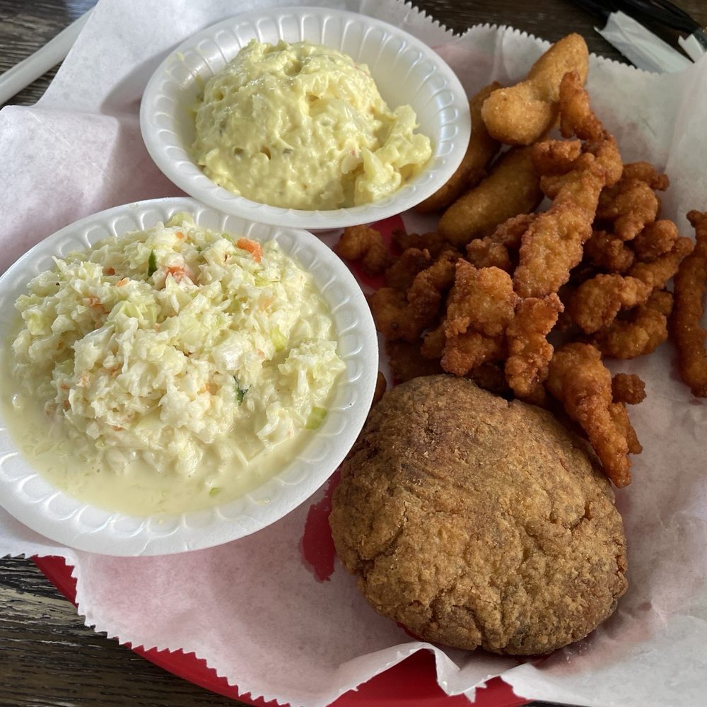Washington Crab - Washington - Crab cake, fried clams (thick batter, short pieces), potato salad, slaw, hush puppies (4 pieces) - Seafood Near Me - Washington, North Carolina Washington Crab - Washington - Crab cake, fried clams (thick batter, short pieces), potato salad, slaw, hush puppies (4 pieces) - Seafood Near Me - Washington, North Carolina