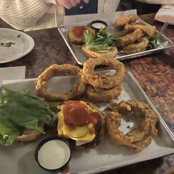 The Rookery - The rookery burger with onion rings. - Bars Near Me - Macon, Georgia The Rookery - The rookery burger with onion rings. - Bars Near Me - Macon, Georgia