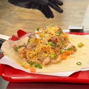 Southern Taco - The build of the grnd Turkey Crawfish and Shrimp Burrito with everything including Whop Whop sauce. - Tacos Near Me - Baldwin Hills, California Southern Taco - The build of the grnd Turkey Crawfish and Shrimp Burrito with everything including Whop Whop sauce. - Tacos Near Me - Baldwin Hills, California