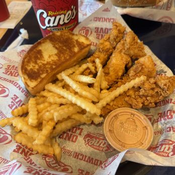 Raising Cane's Chicken Fingers - Box Combo: four chicken fingers, crinkle-cut fries, one Cane's sauce, Texas toast, coleslaw, and a 22 oz. fountain drink or tea - Fast Food Near Me - Poway, California