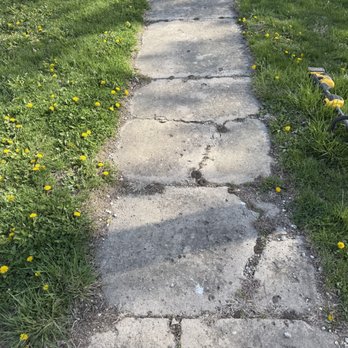 NeatNess Outdoor Services - Overgrown walkway before edging. - Lawn Services Near Me - Marengo, Iowa