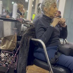 Paul Mitchell the School Cleveland - Ponytail with beautiful curls flowing down the side of her face, classy, elegant a touch of playfulness in this beautiful lady