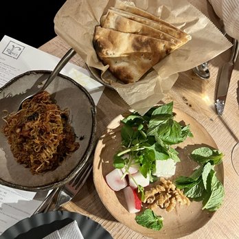 Rumis Kitchen - Kashk Badenjoon. Fried eggplant with crispy onion and mint. Perfect to pair with the fresh hot pita, herbs, fresh radishes and feta - Persian/Iranian Near Me - Houston, Texas