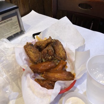 Claw Shack - Hot and lemon pepper wings comes w/some fries on the bottom - Cajun/Creole Near Me - San Jose, California