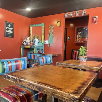 Tres Leches Café - Beautiful interior with colorful chairs, wooden tables, plants, and Mexican decorations - Bakeries Near Me - Phoenix, Arizona Tres Leches Café - Beautiful interior with colorful chairs, wooden tables, plants, and Mexican decorations - Bakeries Near Me - Phoenix, Arizona