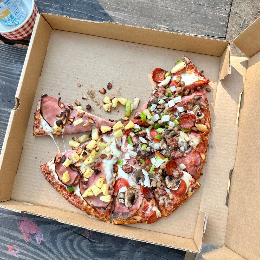Large traditional crust half Hawaiian (with roasted cashews!) and half combo (no black olives). Delish! Large traditional crust half Hawaiian (with roasted cashews!) and half combo (no black olives). Delish!