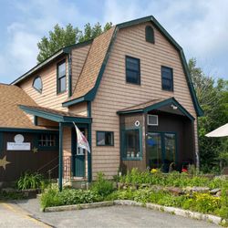 The Optimist Cafe - The cafe is on the right and is attached to an indoor New England Goods shopping "consortium".