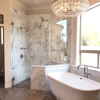 Cornerstone - Master bath in Paradise Valley with genuine Calacatta marble shower and crystal chandelier. - General Contractors Near Me