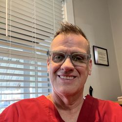 SuperClips Haircuts - Stylist and owner Michael Rock with over 33 years in the business.