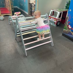 Room to Bloom - My 2 yr old daughter climbing the baby gym equipment