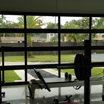 Affordable Garage Door Services - Looking out from a full view garage door. Clear view and this specific door has tinted windows! - Garage Door Services Near Me Affordable Garage Door Services - Looking out from a full view garage door. Clear view and this specific door has tinted windows! - Garage Door Services Near Me