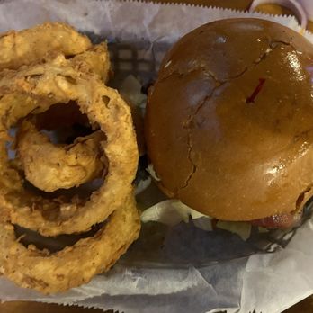 Texas Tradition - Guacamole burger with side of onion rings - American Near Me - Katy, Texas Texas Tradition - Guacamole burger with side of onion rings - American Near Me - Katy, Texas
