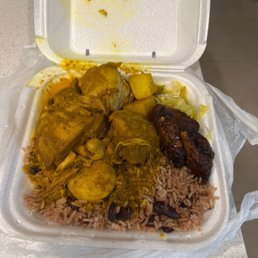 Curry, chicken, plantain , & beans, and rice