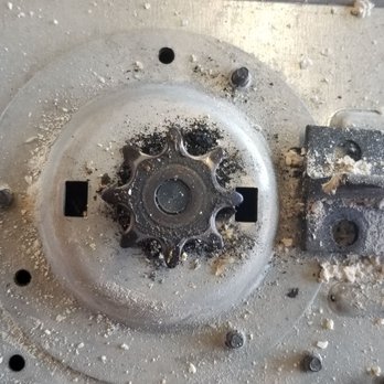 A1 Garage Door Service - Worn pulley for chain to open and close a garage door. Metal fragments. - Garage Door Services Near Me - Phoenix, Arizona A1 Garage Door Service - Worn pulley for chain to open and close a garage door. Metal fragments. - Garage Door Services Near Me - Phoenix, Arizona