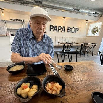Papa Bop - My papa enjoying the kimchi - Korean Near Me - Evanston, Illinois