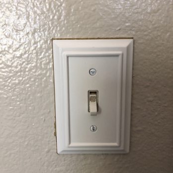 Moa Painting - New light switch plate not able to completely cover area that they did not paint - Painters Near Me - Eastvale, California Moa Painting - New light switch plate not able to completely cover area that they did not paint - Painters Near Me - Eastvale, California
