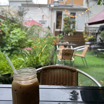 Curiosity By Intrinsic - a jar of iced coffee on a table outside - Japanese Near Me - Kearny, New Jersey Curiosity By Intrinsic - a jar of iced coffee on a table outside - Japanese Near Me - Kearny, New Jersey