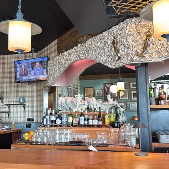 Half Shell - Oyster shells on bar wall - Bars Near Me - Seattle, Washington Half Shell - Oyster shells on bar wall - Bars Near Me - Seattle, Washington