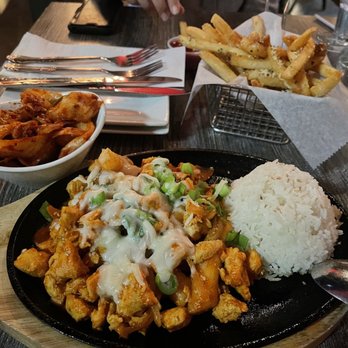 Bonchon - Bull dak with rice, kimchi and seasoned fries - Chicken Wings Near Me - Orlando, Florida Bonchon - Bull dak with rice, kimchi and seasoned fries - Chicken Wings Near Me - Orlando, Florida