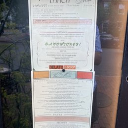 a menu in a window of a restaurant