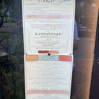 Via Mare - a menu in a window of a restaurant - Salad Near Me - Nantucket, Massachusetts