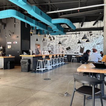 The Roosevelt Coffeehouse - people sitting at tables and working on laptops - Coffee Roasteries Near Me - Columbus, Ohio
