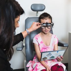 Photograph of a young patient undergoing an eye exam at Royal Oak Optometry.