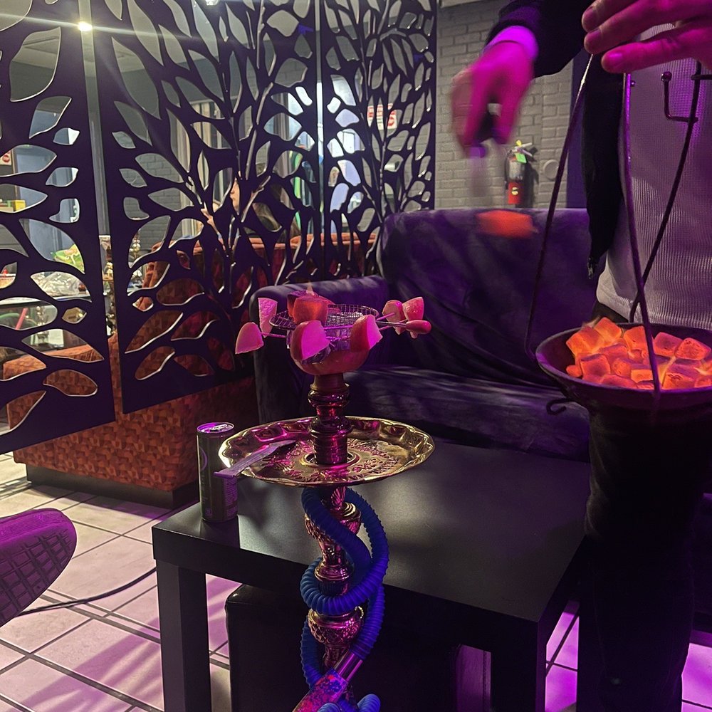 Replenishing Hookah Charcoals. Extremely Attentive. Replenishing Hookah Charcoals. Extremely Attentive.