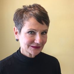 A fresh look shorter hair and grown out natural color.