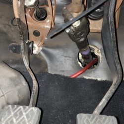 Empire Sound & Security - Power cable being ran through the steering linkage.  Not secured at all.