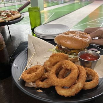 Larks Entertainment - Smash burger with onion rings - Eatertainment Near Me - Fairview, Texas Larks Entertainment - Smash burger with onion rings - Eatertainment Near Me - Fairview, Texas