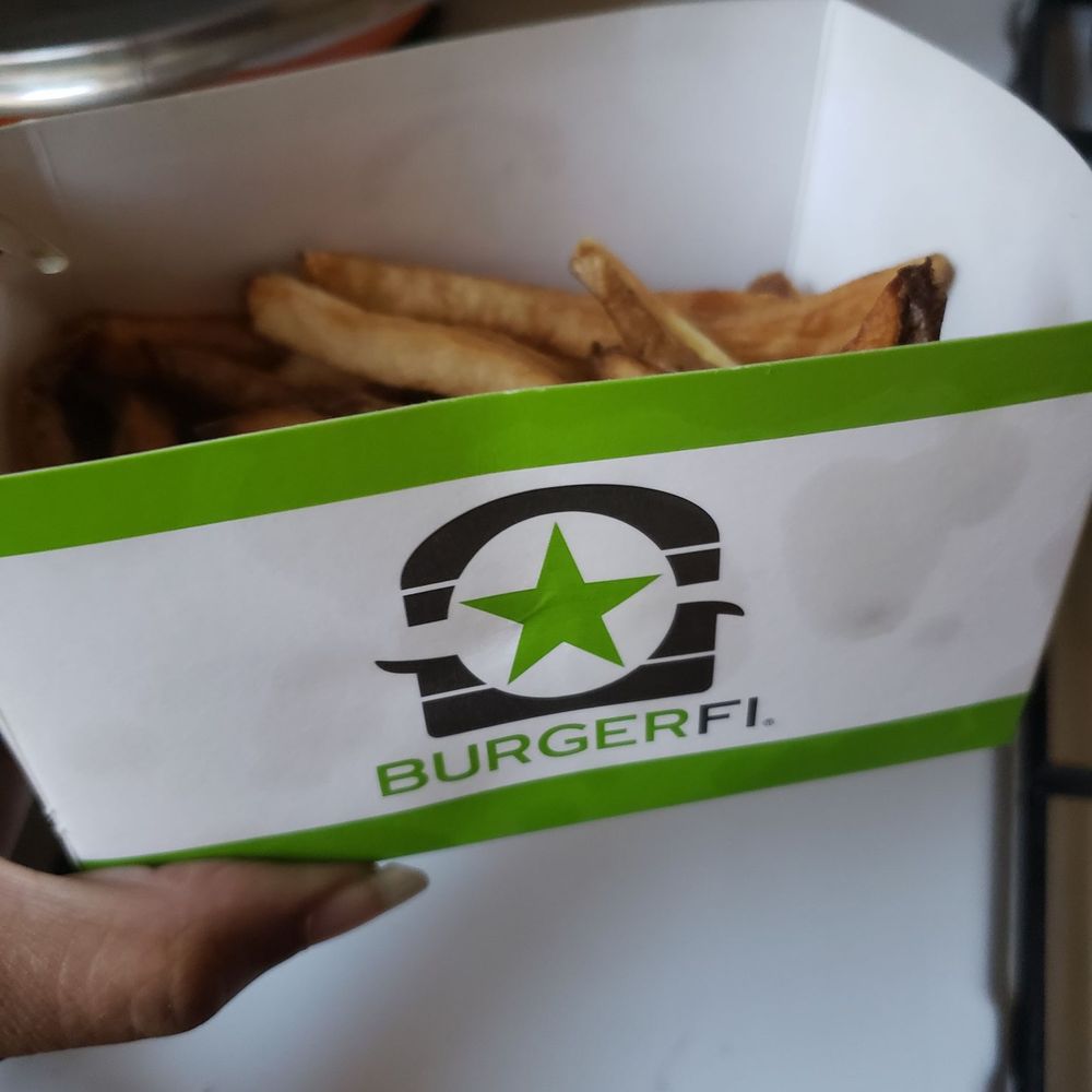 BurgerFi - Picture of me holding the left over fries from Burger Fi that I will not be eating. - Burgers Near Me - Silver Spring, Maryland BurgerFi - Picture of me holding the left over fries from Burger Fi that I will not be eating. - Burgers Near Me - Silver Spring, Maryland
