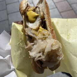 Nola dog : andouille sausage, grilled onions and added sourcrout and mustard Nola dog : andouille sausage, grilled onions and added sourcrout and mustard