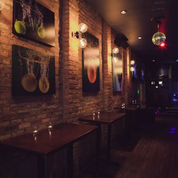 Splash Chicago - a row of tables in a dimly lit restaurant - Dance Clubs Near Me - Chicago, Illinois Splash Chicago - a row of tables in a dimly lit restaurant - Dance Clubs Near Me - Chicago, Illinois