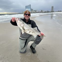 Riptide Bait & Tackle - My cousin with a massive striper!