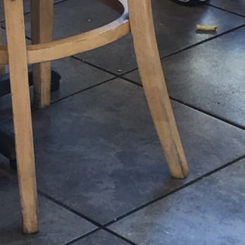 Five Guys - a cat sitting on a wooden chair - Burgers Near Me - Fort Myers, Florida Five Guys - a cat sitting on a wooden chair - Burgers Near Me - Fort Myers, Florida