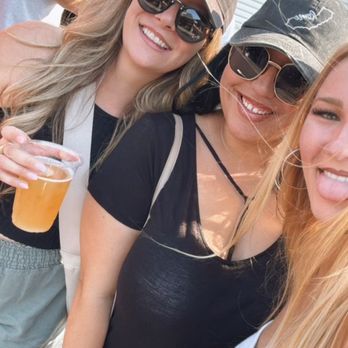 Four Sons Brewing - Girls enjoying some reggae, beer and seltzers - Breweries Near Me - Huntington Beach, California Four Sons Brewing - Girls enjoying some reggae, beer and seltzers - Breweries Near Me - Huntington Beach, California