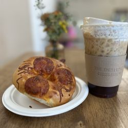 The Dwelling Coffee Shop - Harvest Moon shaken espresso and pizza bagel
