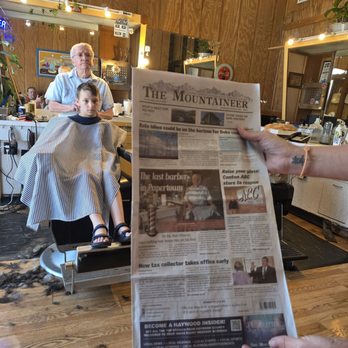 Pisgah Barber Shop - Ken Warren, the last barber in Papertown, cutting our boys hair... with the newspaper article about him in the foreground. - Barbers Near Me - Canton, North Carolina Pisgah Barber Shop - Ken Warren, the last barber in Papertown, cutting our boys hair... with the newspaper article about him in the foreground. - Barbers Near Me - Canton, North Carolina