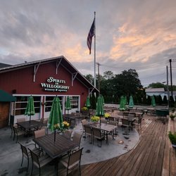 Spirits In Willoughby - Large Patio that offers Gas firepit under a gazebo, seating with umbrellas, picnic tables and 2 bocce courts