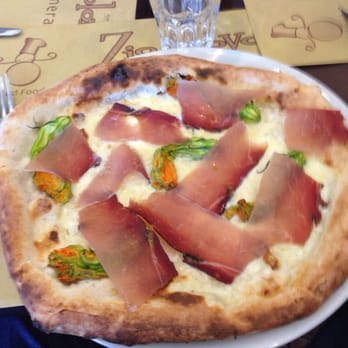 Zio Provolone Lorenteggio - Zucchini flower and speck pizza - Italian Near Me - Milan, Michigan Zio Provolone Lorenteggio - Zucchini flower and speck pizza - Italian Near Me - Milan, Michigan