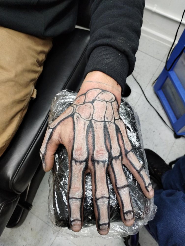 Outwest Tattoo and Body Piercing Logo