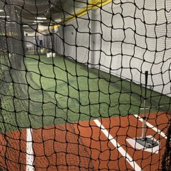 The Refinery Group - Tunnel 5 baseball pitching machine.