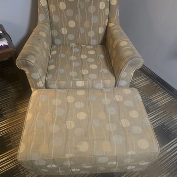 Days Inn by Wyndham Sidney - Old stained chair. - Hotels Near Me - Sidney, Nebraska