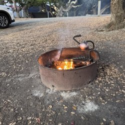 Laguna Seca Recreation Area - Me using the campfire bbq to cook the day before Jim told me I couldn't.
