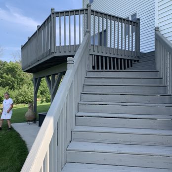 AJ Formations - a man walking up a set of stairs - General Contractors Near Me - Mukwonago, Wisconsin