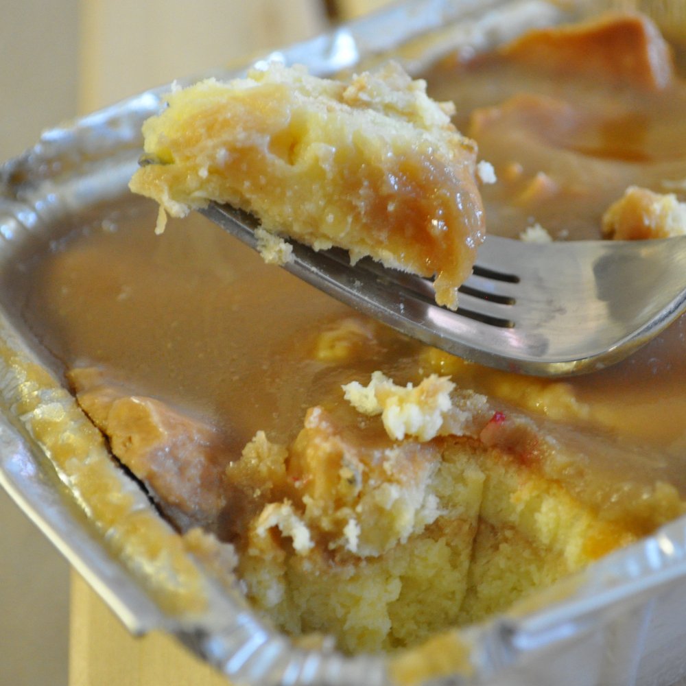 Sweet Surrender Bakery - White Chocolate Bread Pudding with Carmel Sauce - Bakeries Near Me - Bakersfield, California Sweet Surrender Bakery - White Chocolate Bread Pudding with Carmel Sauce - Bakeries Near Me - Bakersfield, California